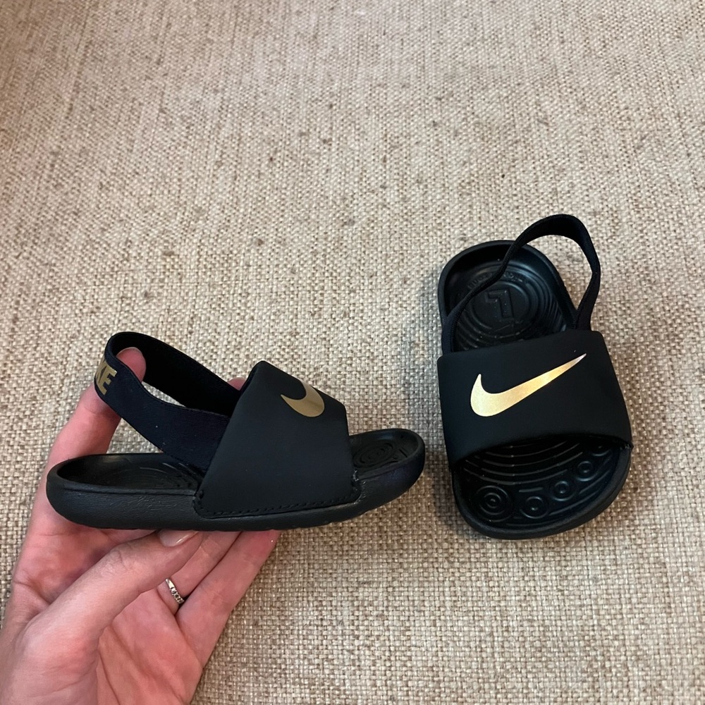 Baby Nike gold and black sandals